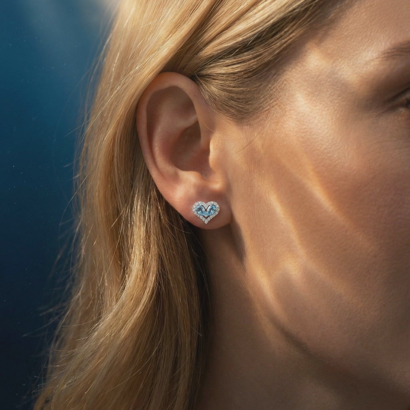 Heart-shaped natural aquamarine drop earrings in solid gold.