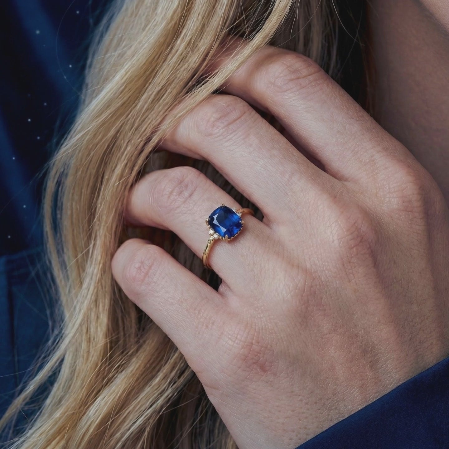 The Arisara cushion cut simulated sapphire ring in solid gold.