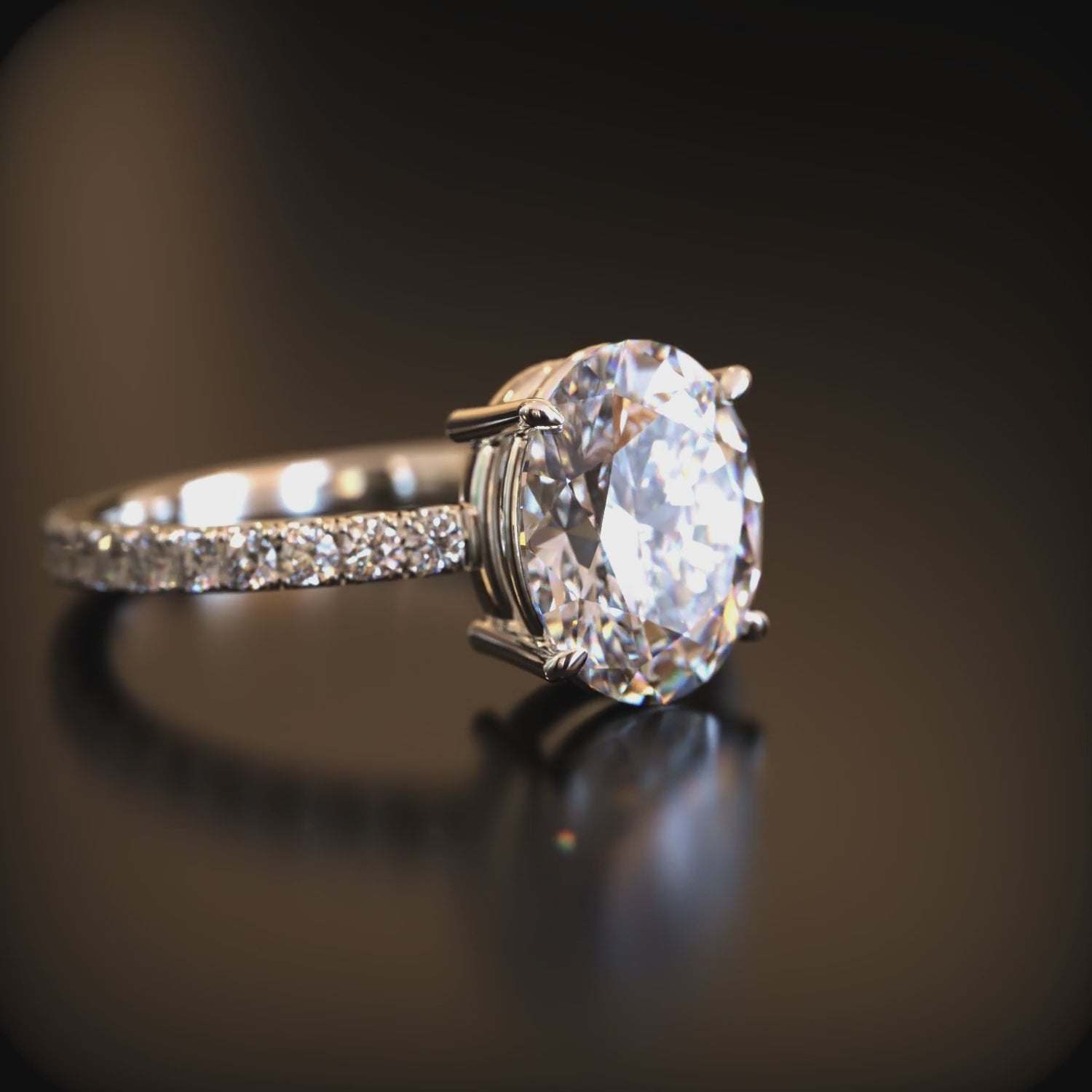 Video of The Liana 3 carat oval moissanite ring crafted in 14K solid white gold.