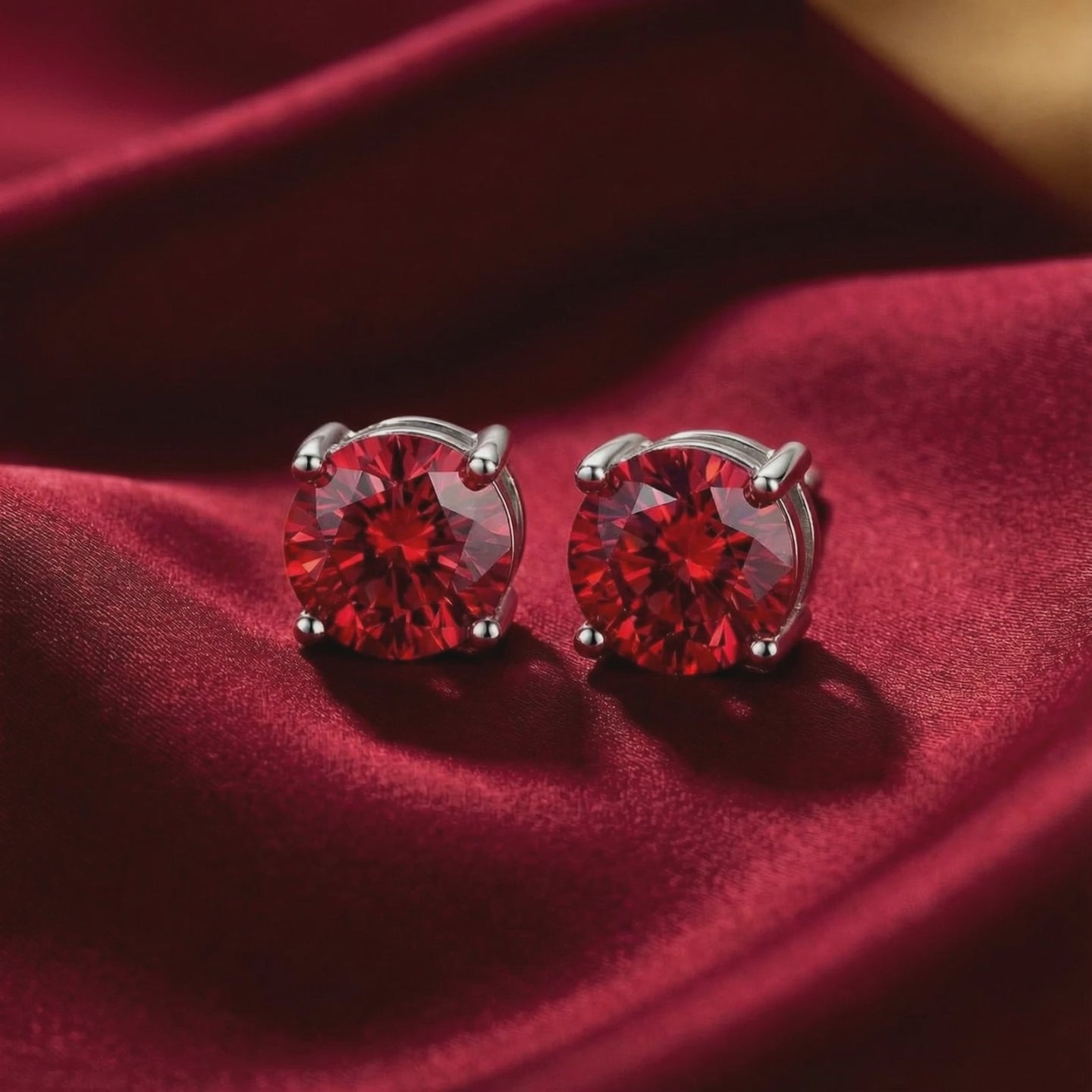 Simulated ruby stud earrings in solid gold.