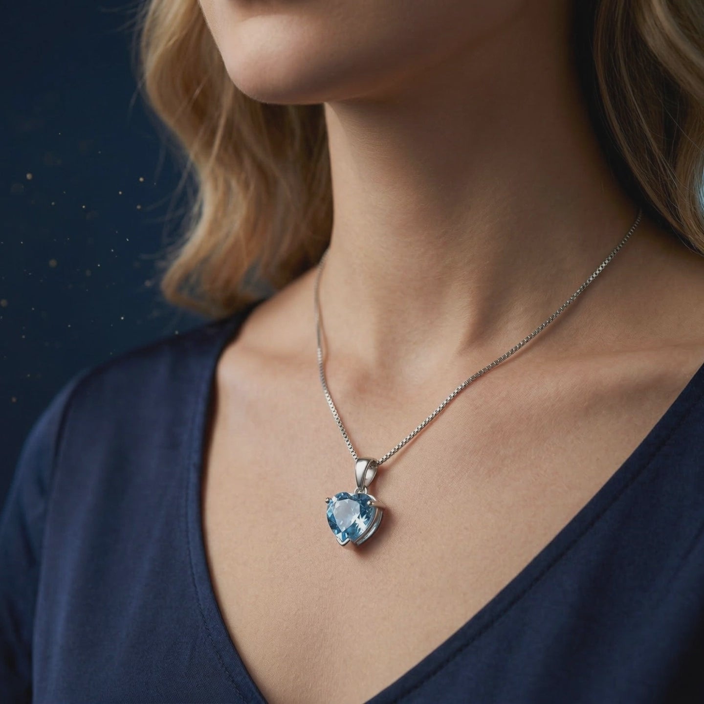 A natural blue topaz heart-cut pendant necklace in solid gold.