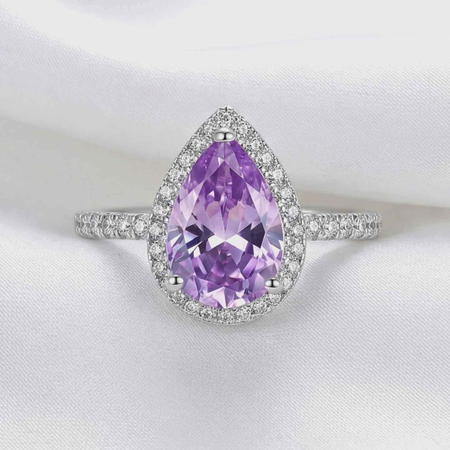 Video of the Odette simulated amethyst halo ring in solid gold.