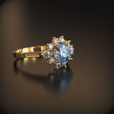 A ring with a blue moissanite center stone and halo in solid gold.