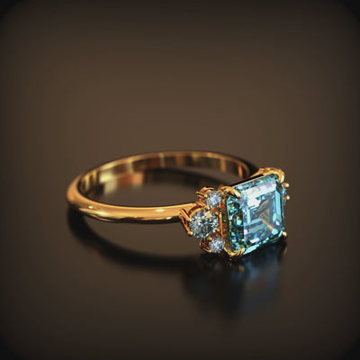 A solid gold ring with a blue moissanite.