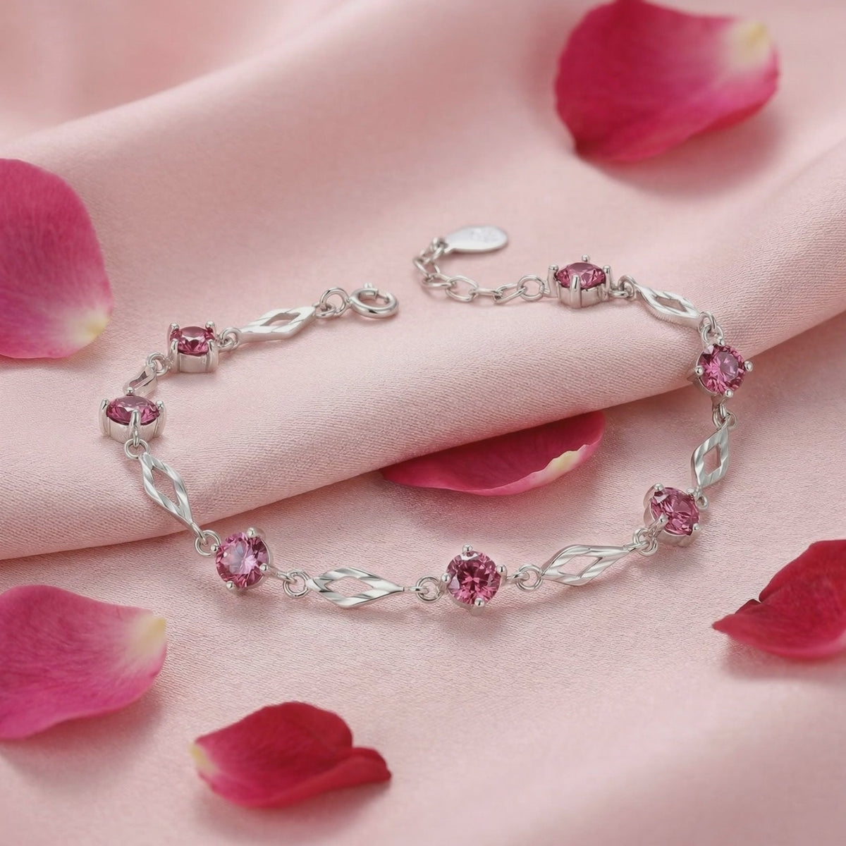 Solid gold bracelet with simulated pink tourmaline stones.
