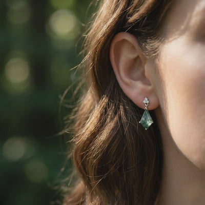 Video of kite cut natural Moss Agate drop earrings in solid gold.