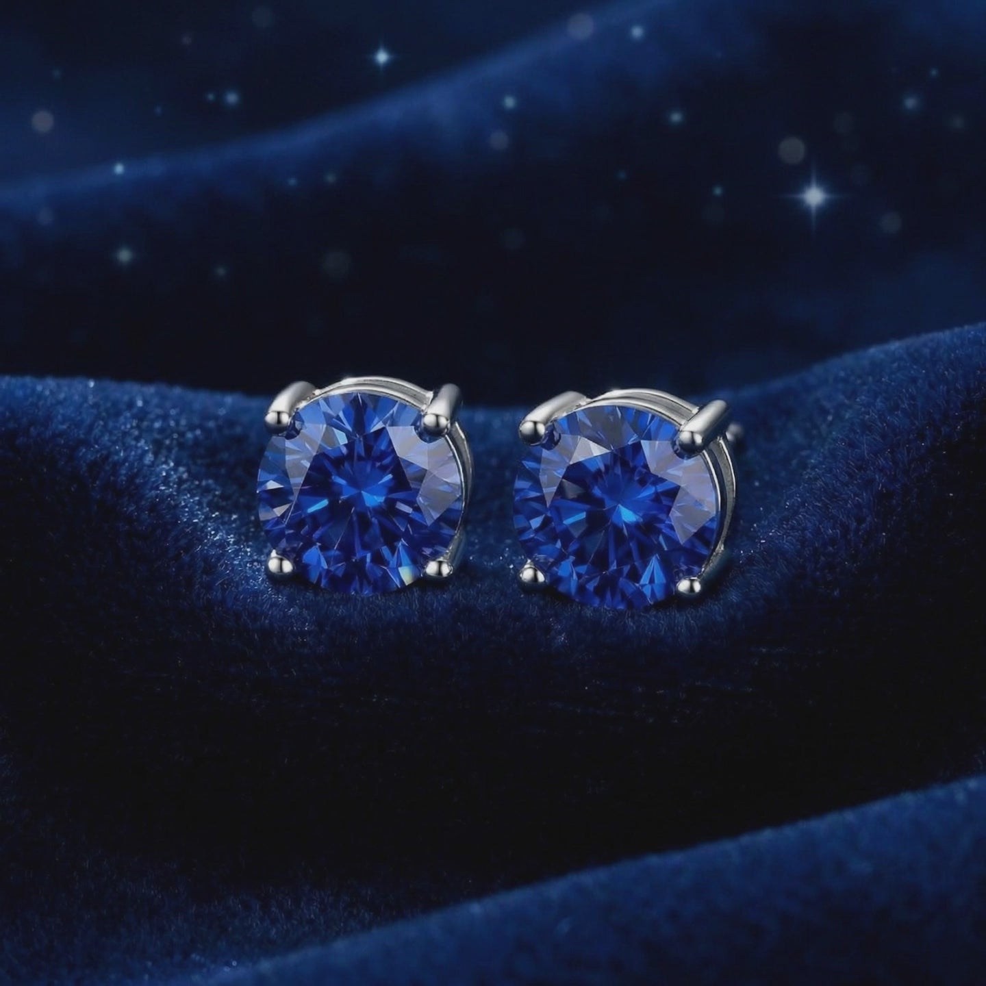 Royal blue simulated sapphire stud earrings in solid gold.