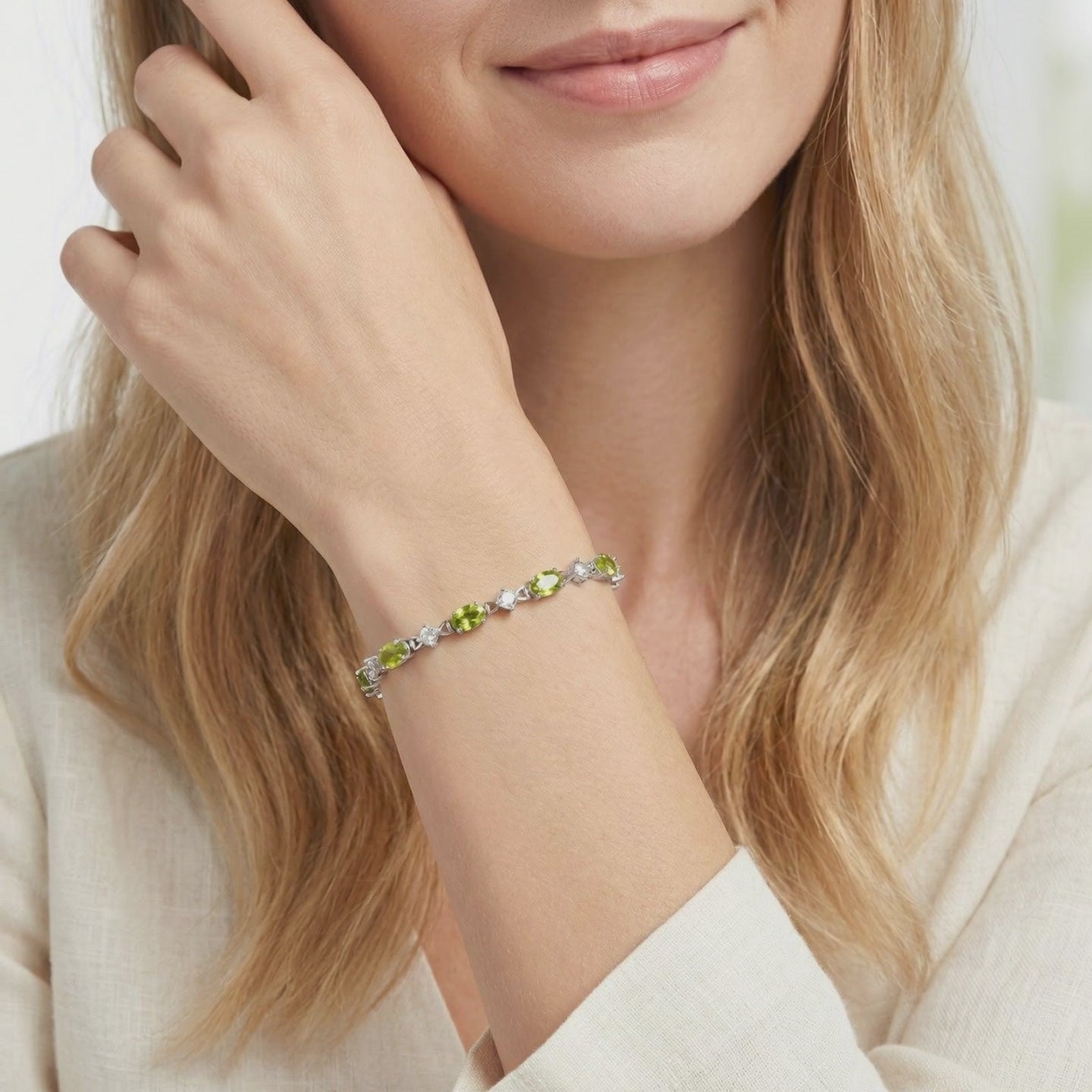 Solid gold bracelet with simulated peridot stones.