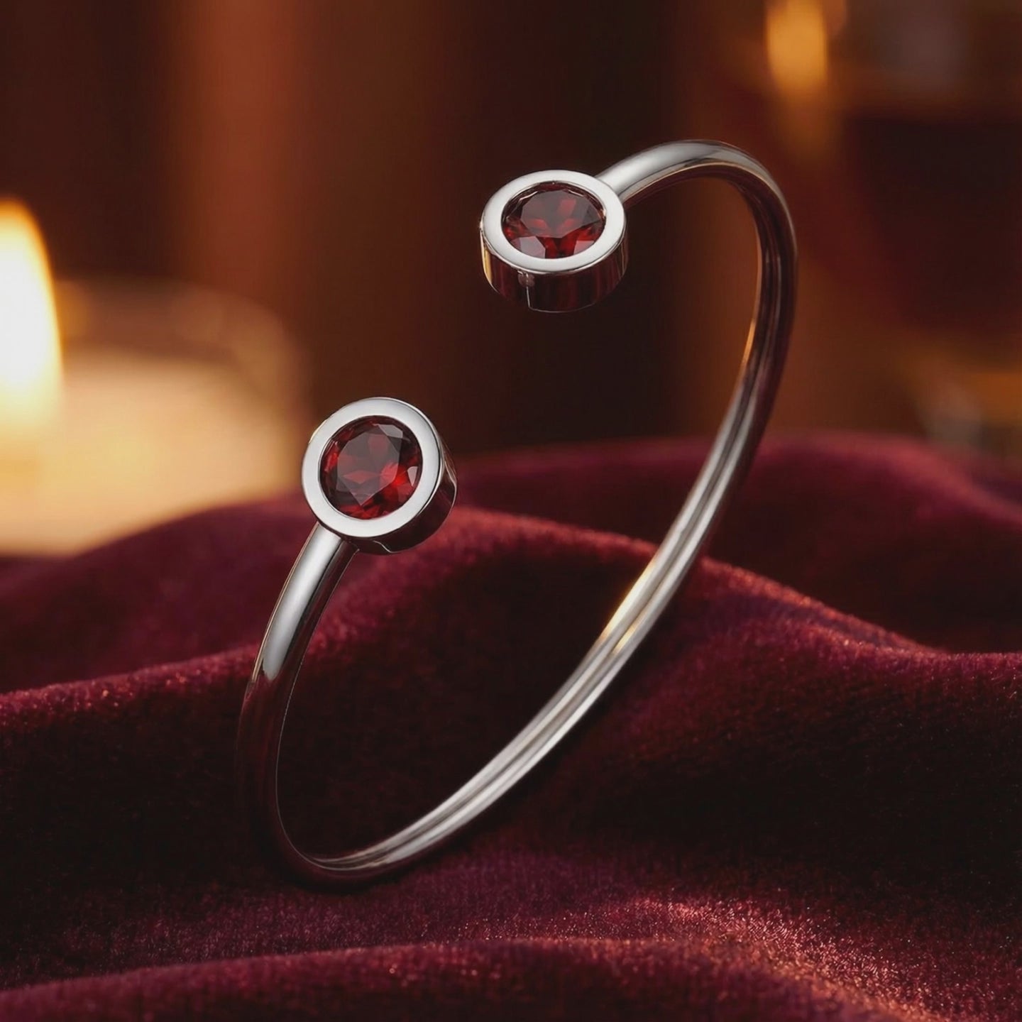 Solid gold cuff bracelet with simulated garnets.