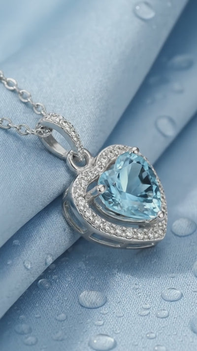 Simulated aquamarine heart pendant necklace in solid gold.