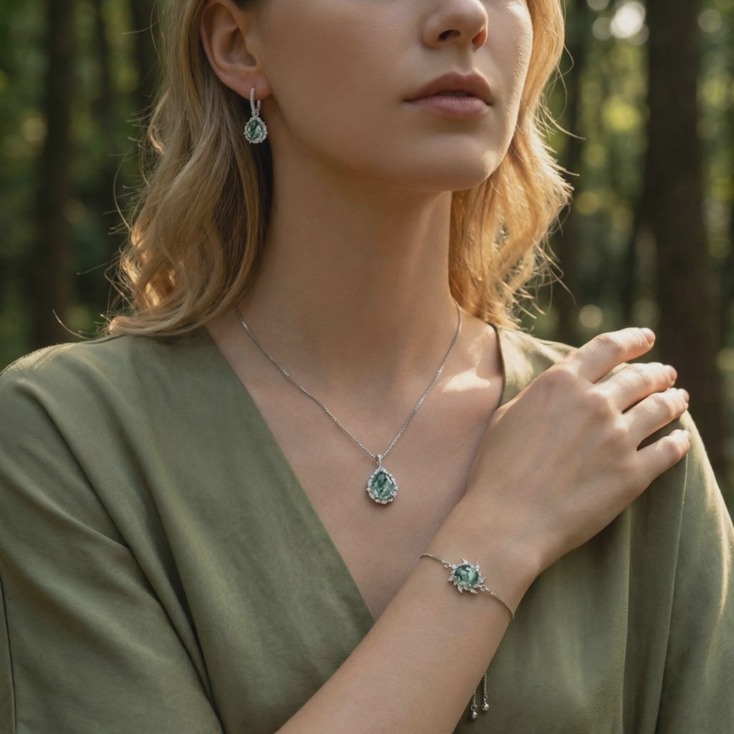 Moss Agate jewelry set in solid gold, including necklace, earrings, and bracelet.