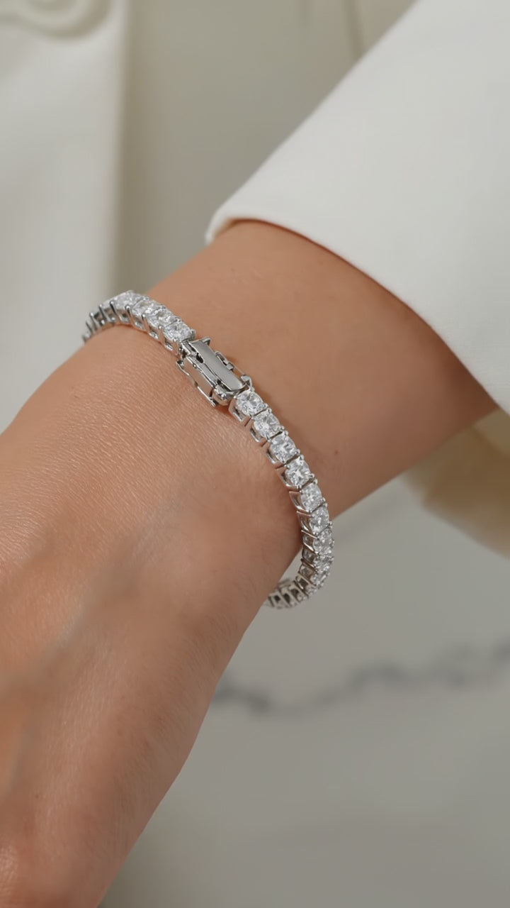A solid gold moissanite tennis bracelet.