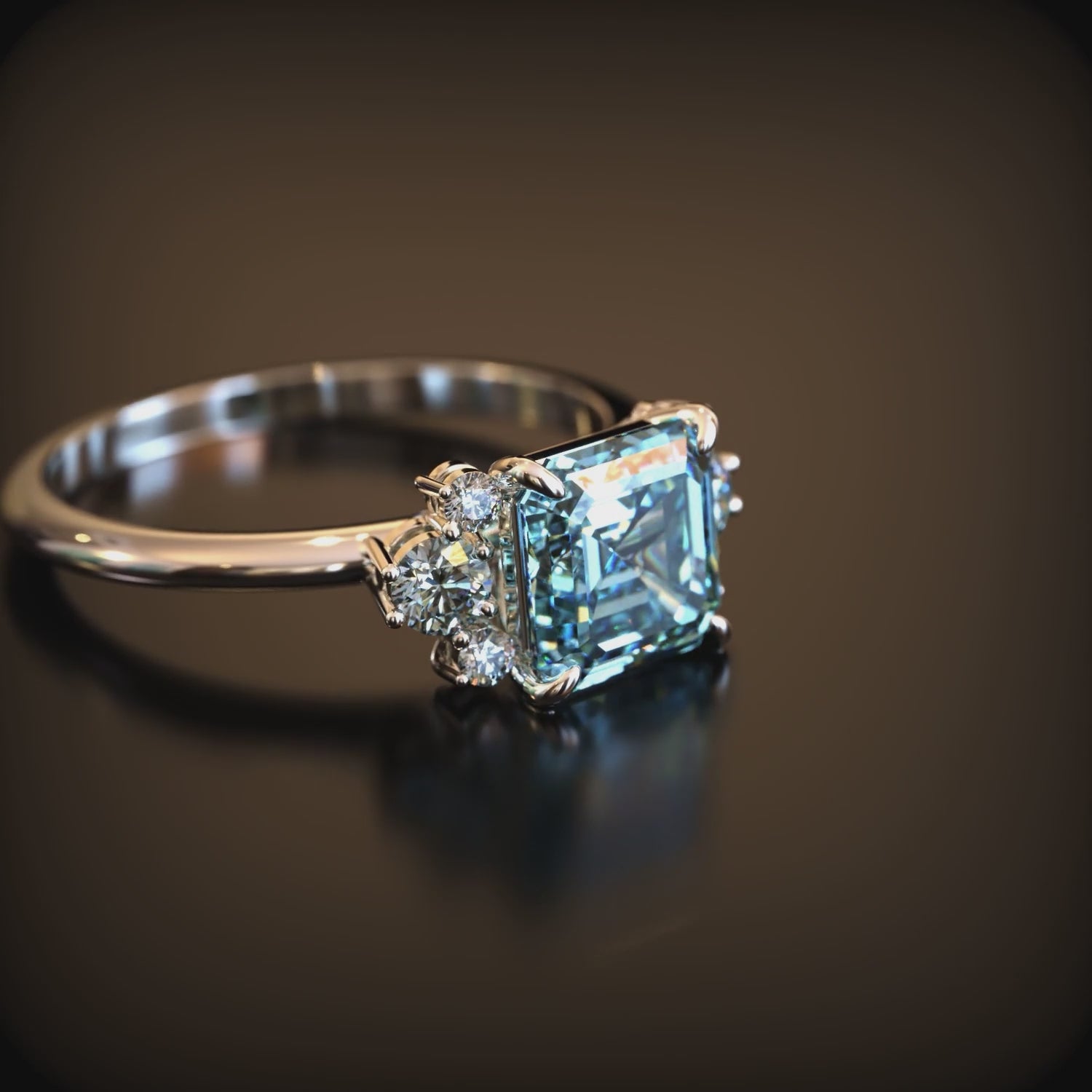 A solid gold ring with a blue moissanite.