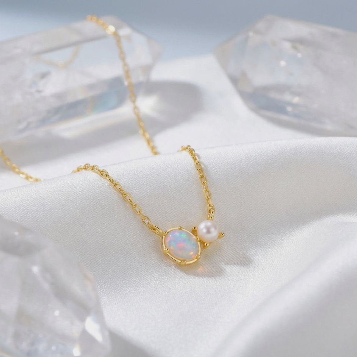 Lumira oval white opal necklace in solid gold.