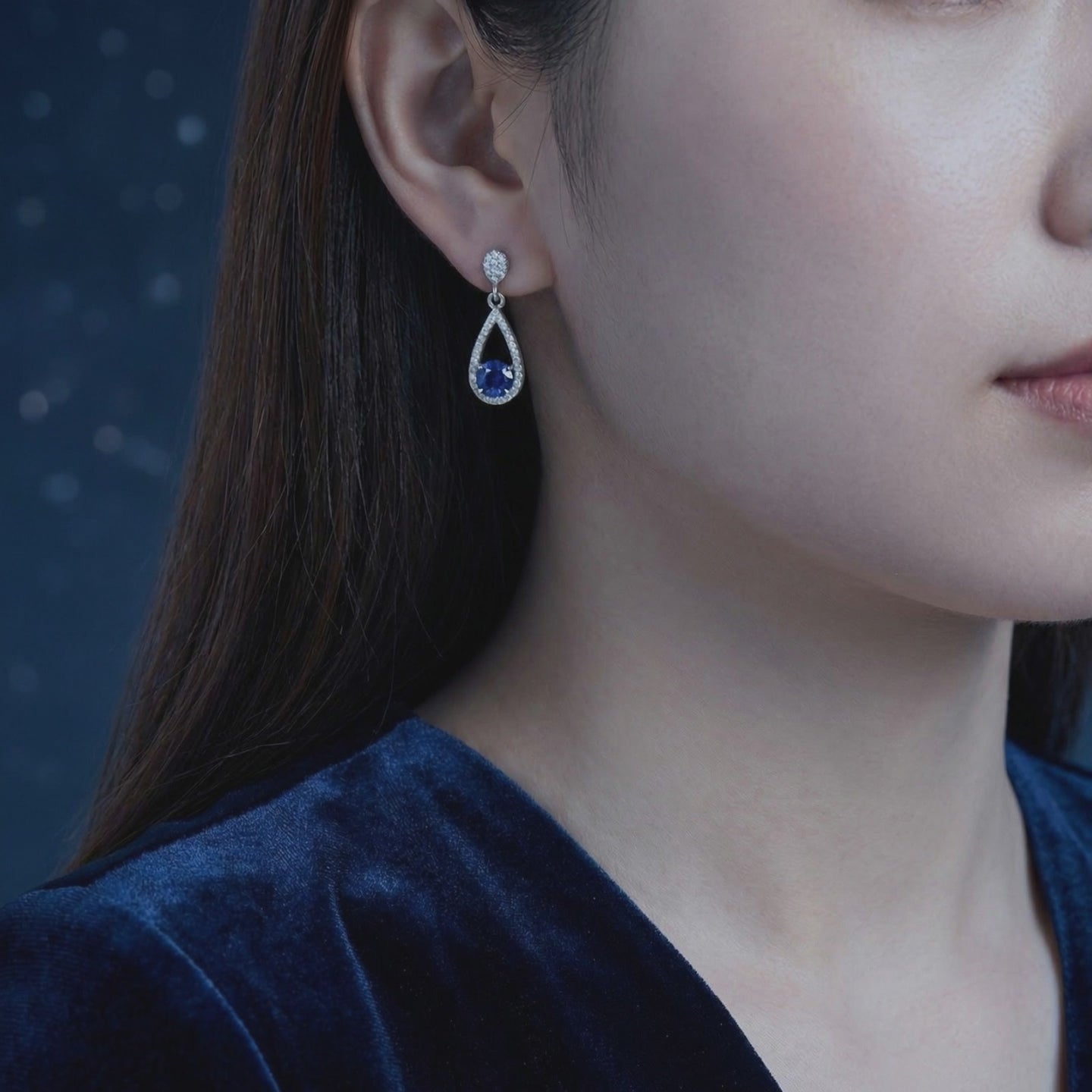 Teardrop earrings with simulated sapphires in solid gold.