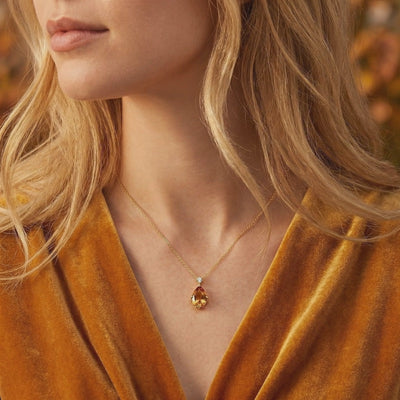 Video of The Aurelienne pear-cut simulated topaz solid gold necklace.