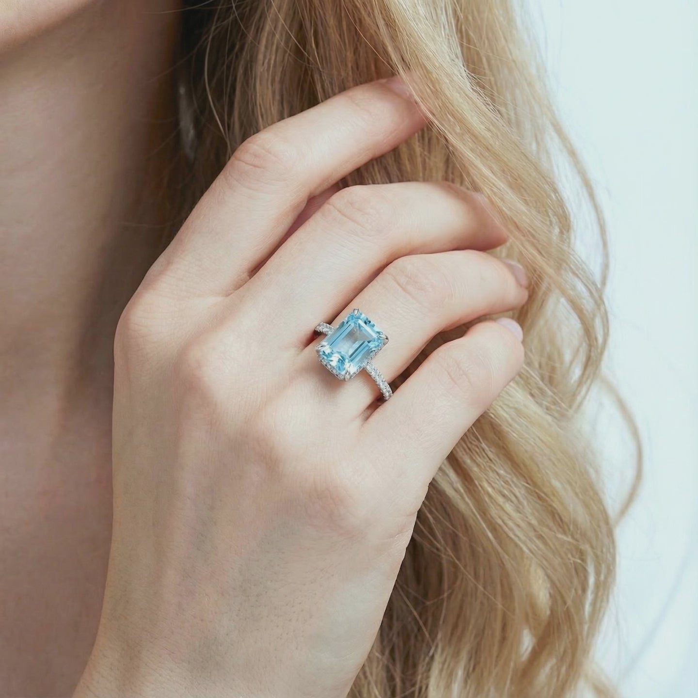 Radiant simulated aquamarine ring in solid gold.