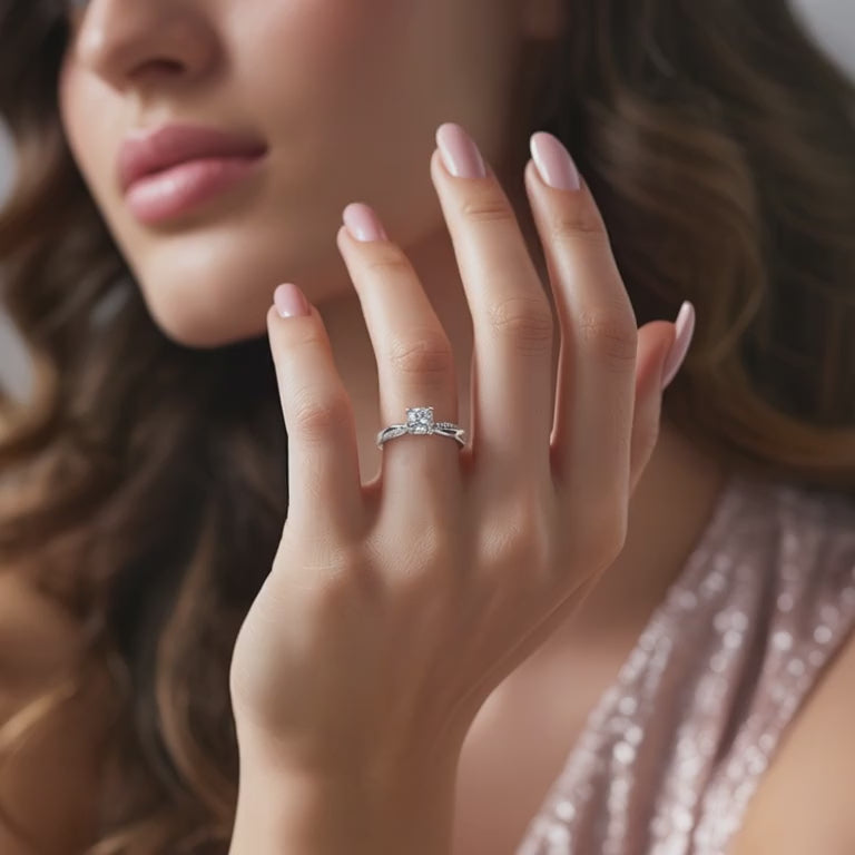 A solid gold ring with a twisted band and moissanite center stone.