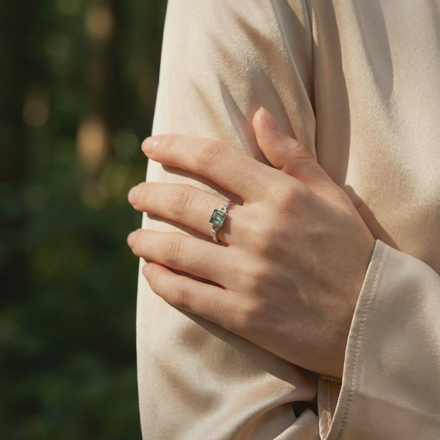 A solid gold ring with a natural moss agate gemstone.