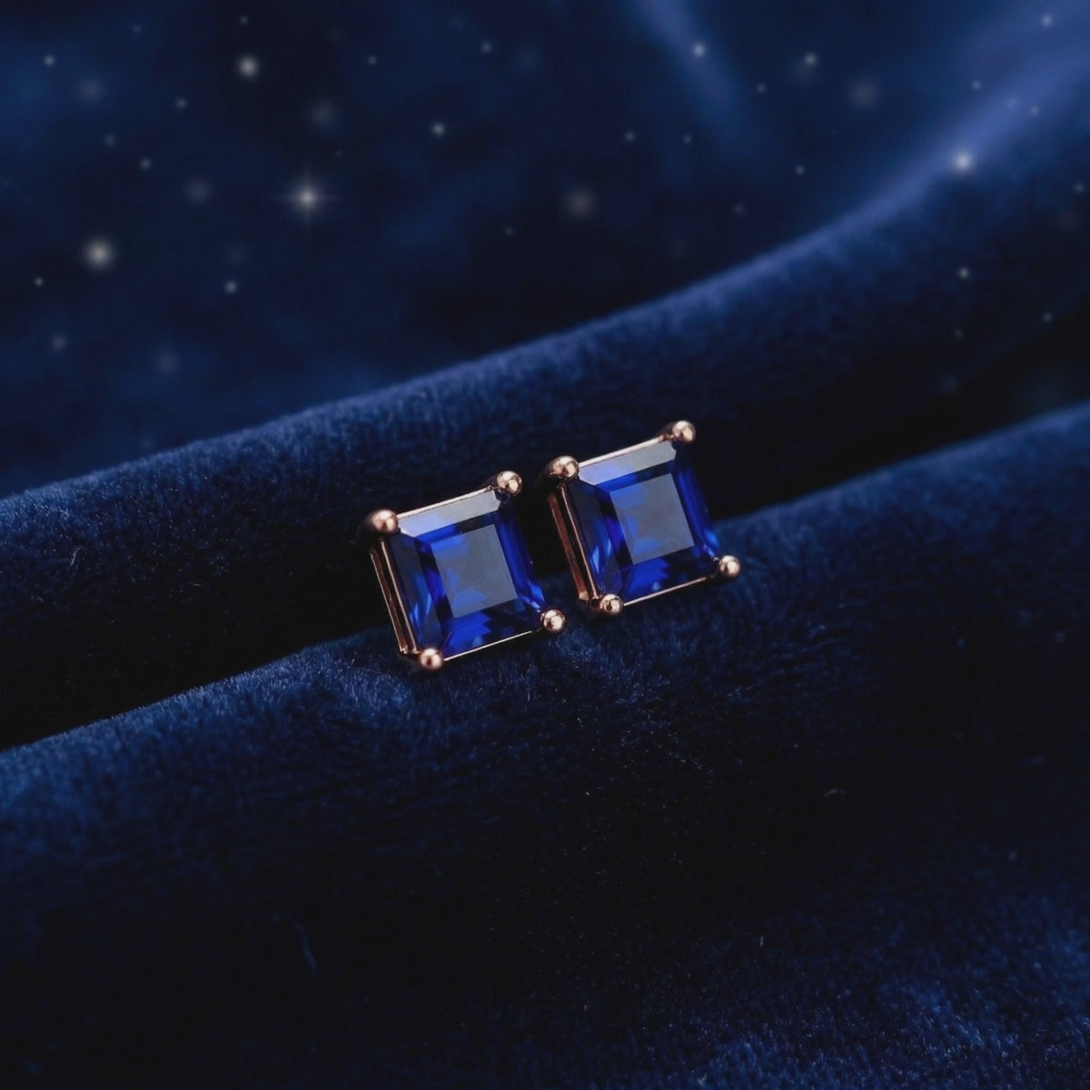 Square simulated sapphire stud earrings in solid gold.