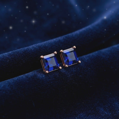 Square simulated sapphire stud earrings in solid gold.