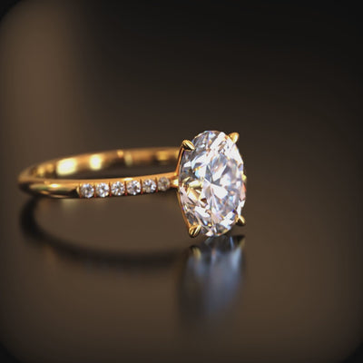 Video of an oval moissanite ring in solid gold.