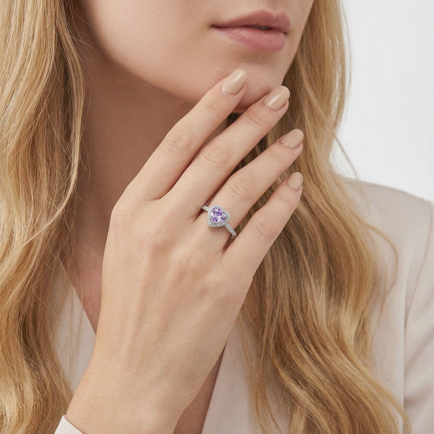 Heart-cut simulated amethyst halo ring in solid gold.