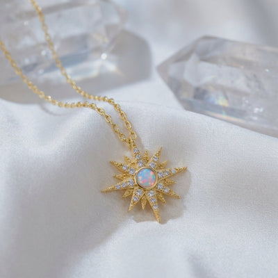 Solid gold Astralia necklace with natural white opal pendant.