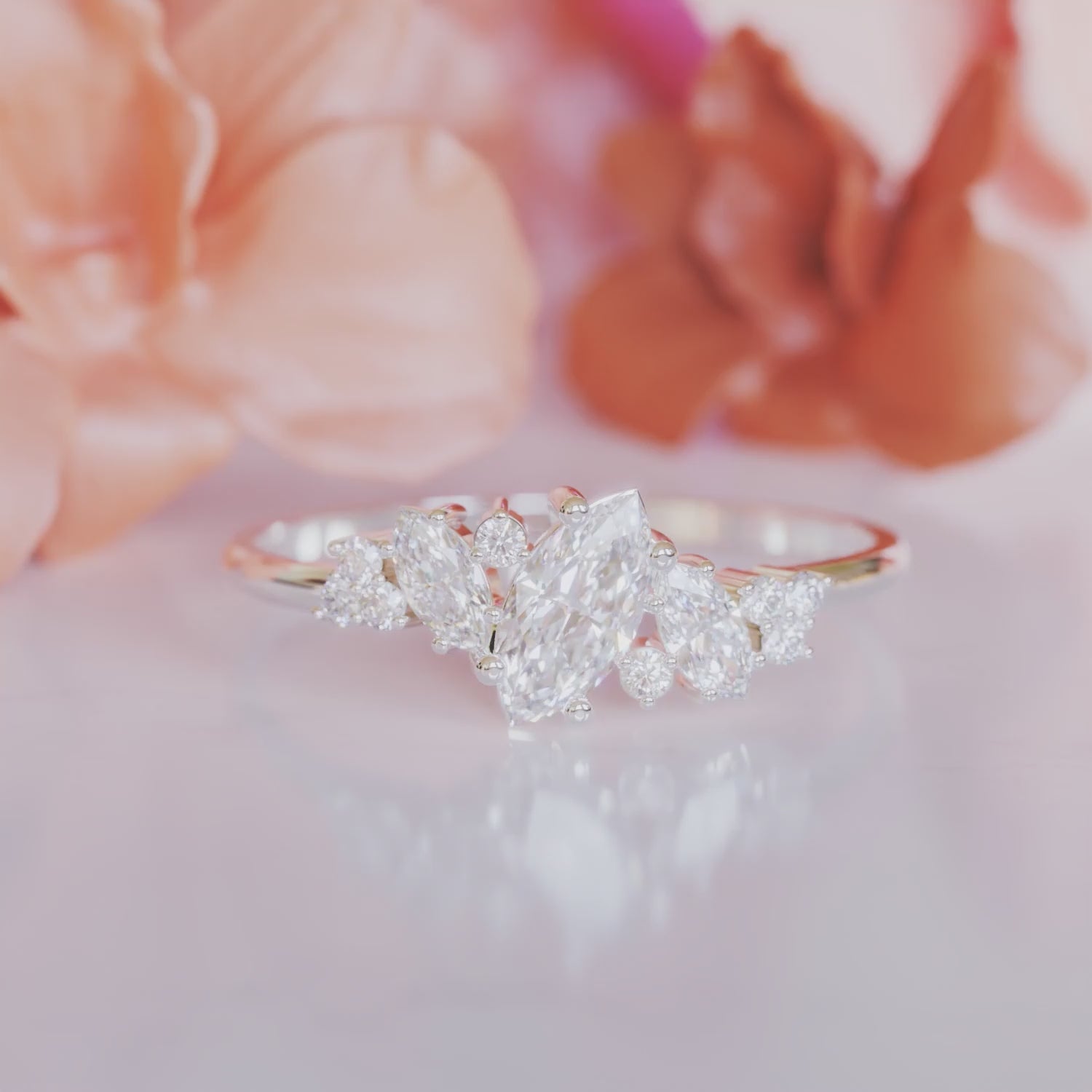 A 14K solid gold ring, The Cluster, with marquise moissanite in a cluster prong setting.