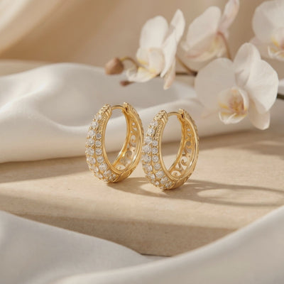 Moissanite J-hoop earrings in solid gold.