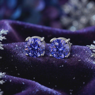 Simulated tanzanite stud earrings in solid gold.