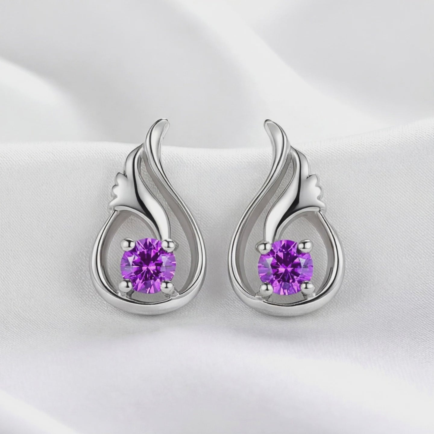 Lysithea Drop simulated amethyst earrings in solid gold.