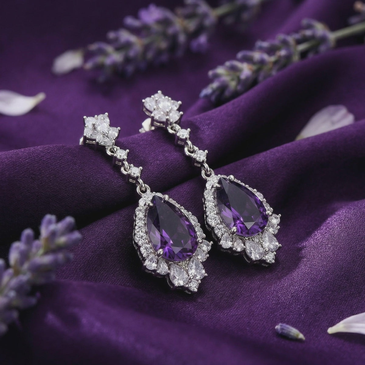 Natural amethyst pear drop earrings in solid gold.