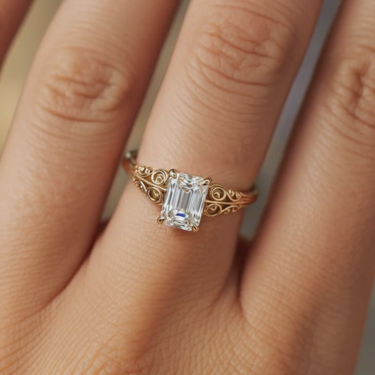 The Adelina Rae emerald-cut moissanite ring in solid gold.