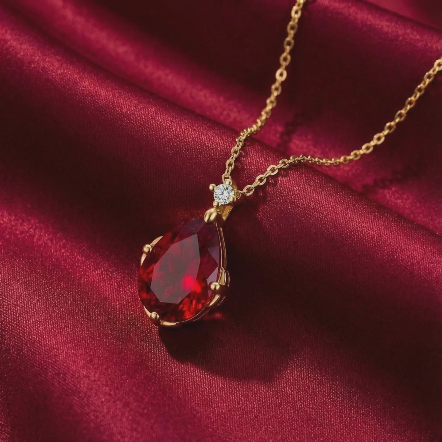 The Celestara Teardrop simulated ruby necklace in solid gold.