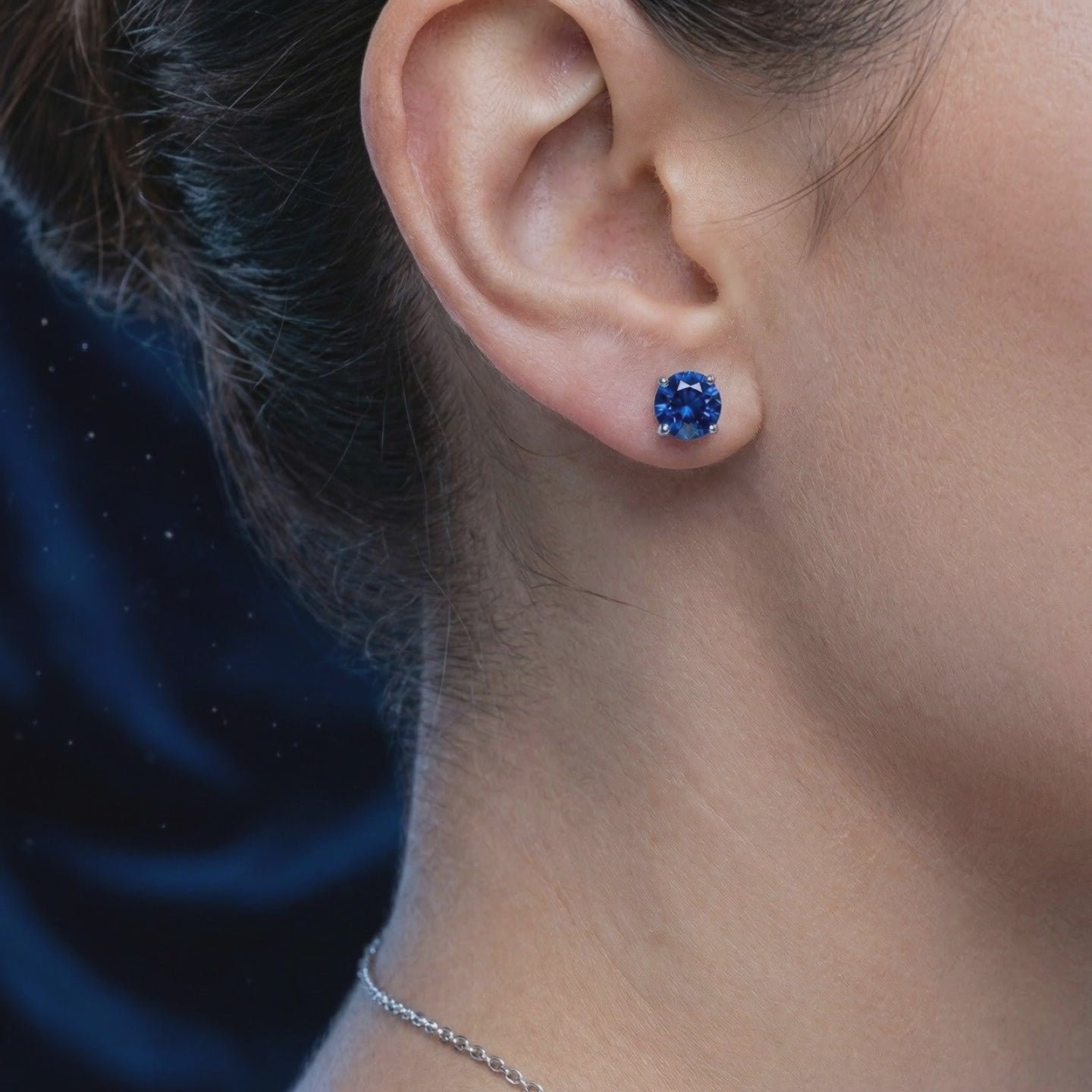 Royal blue simulated sapphire stud earrings in solid gold.