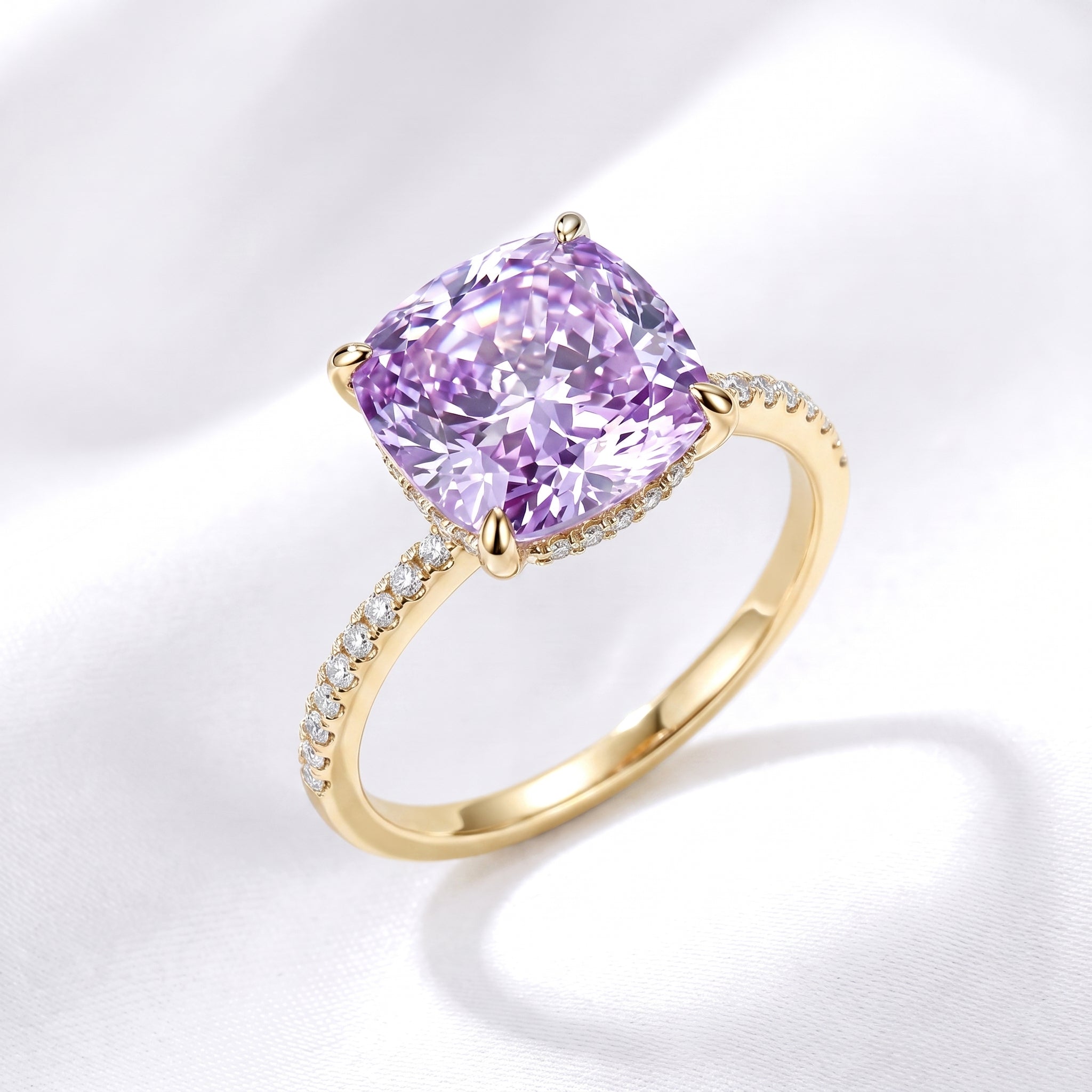 The Ariadne Halo Ring with a simulated amethyst in solid yellow gold.