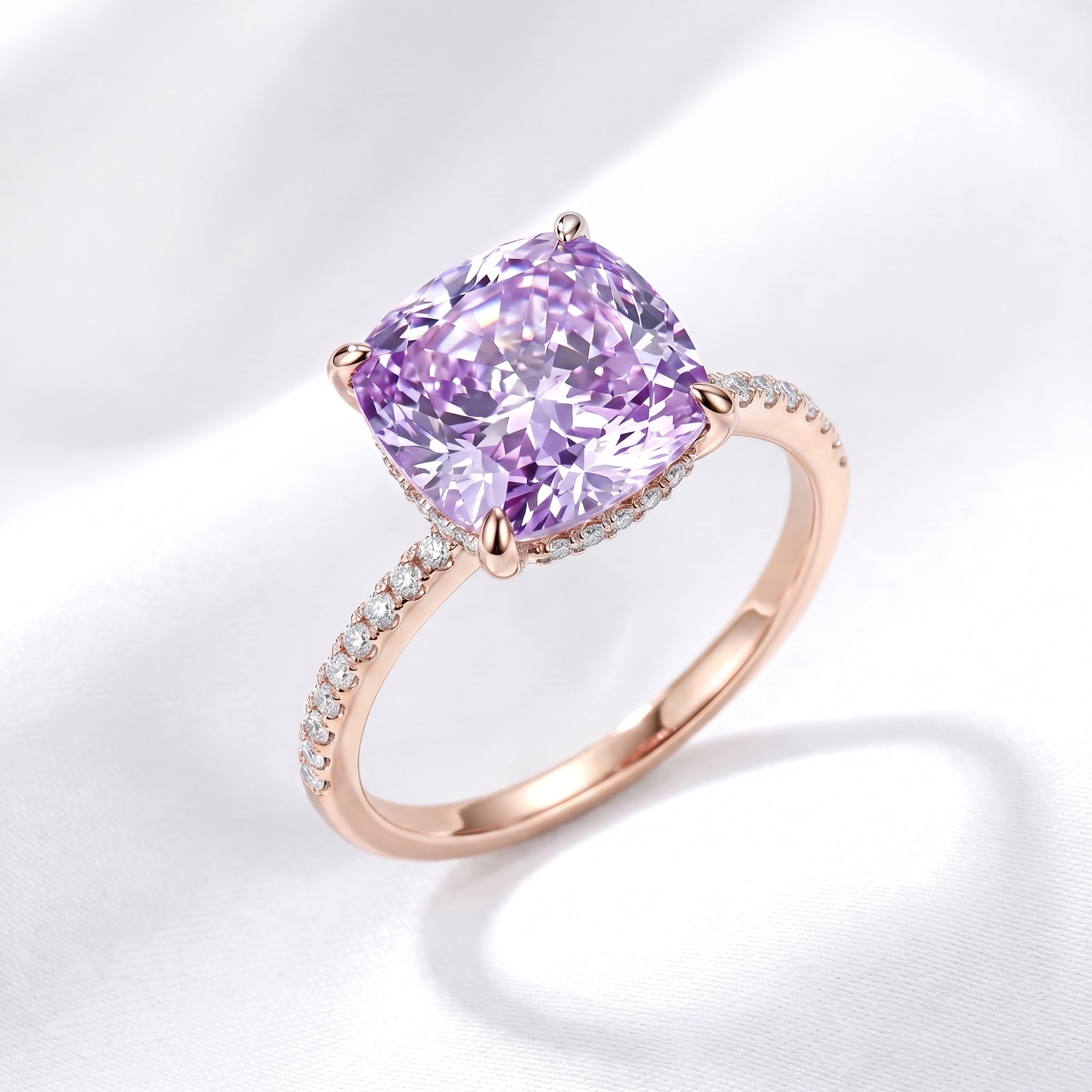 The Ariadne Halo Ring with a simulated amethyst in solid rose gold.