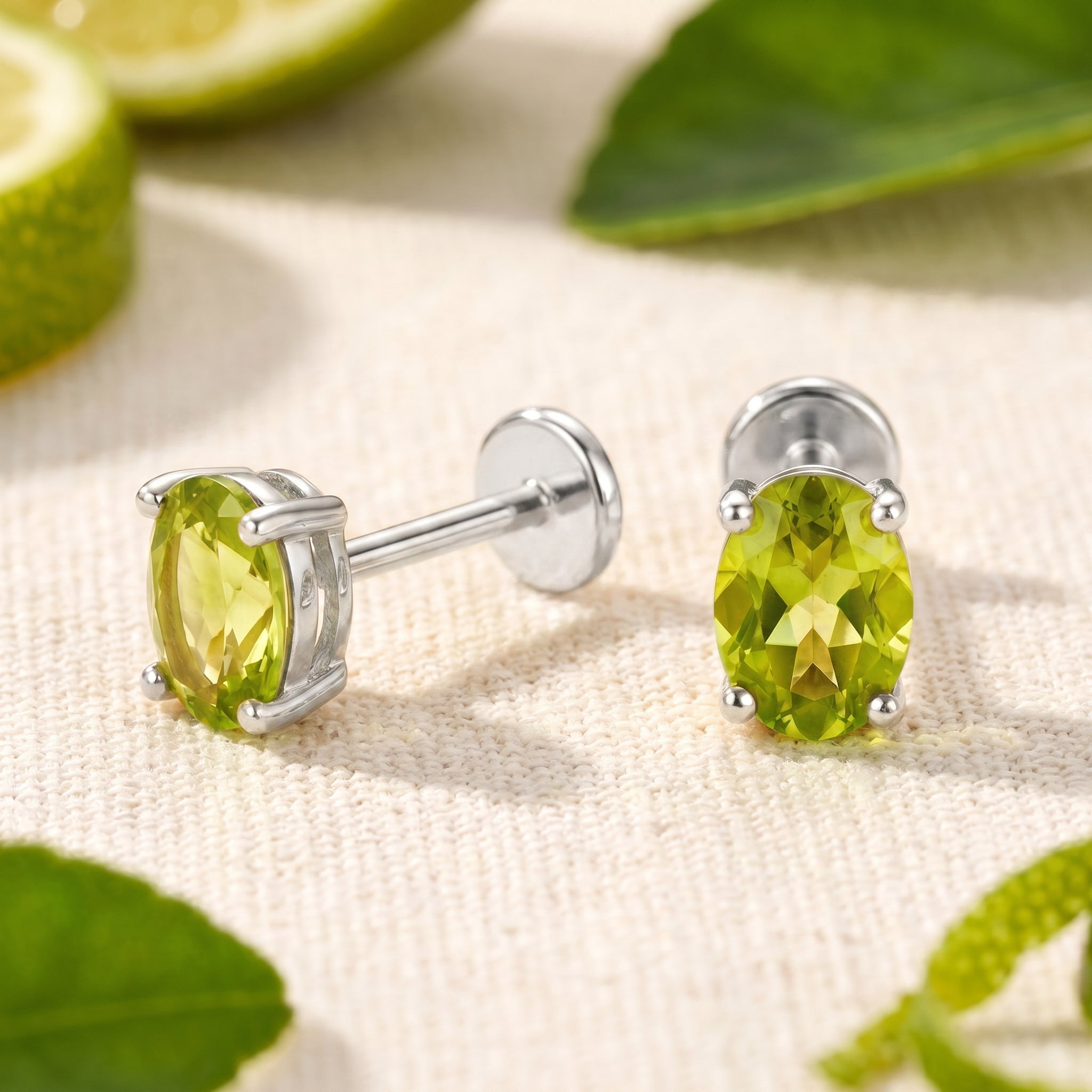 Periselle Oval simulated peridot stud earring in solid white gold.