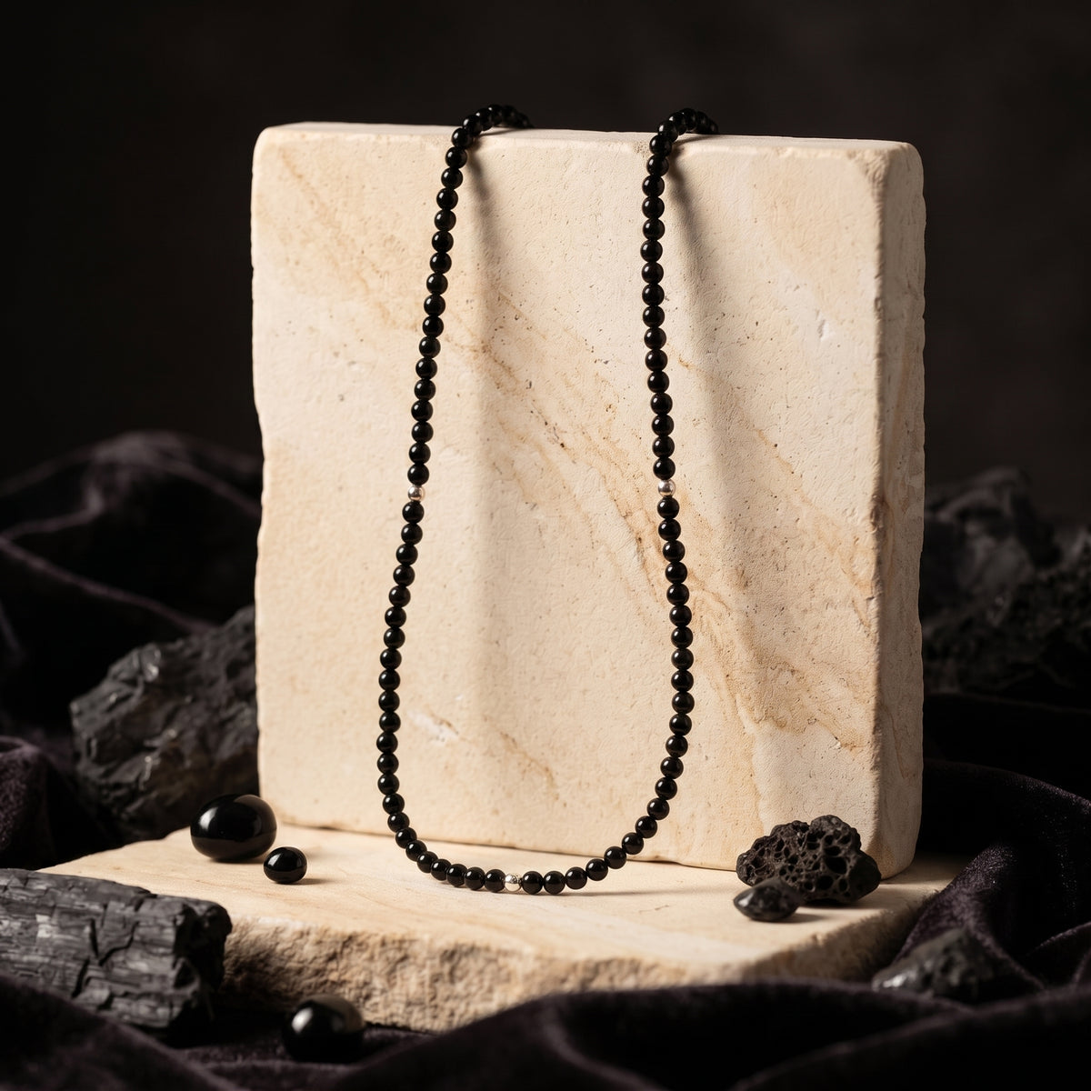 Solid yellow gold necklace with natural black onyx beads.